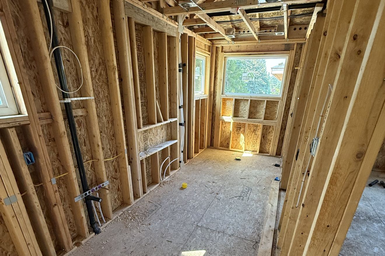 Before: the same master bathroom at the framing stage